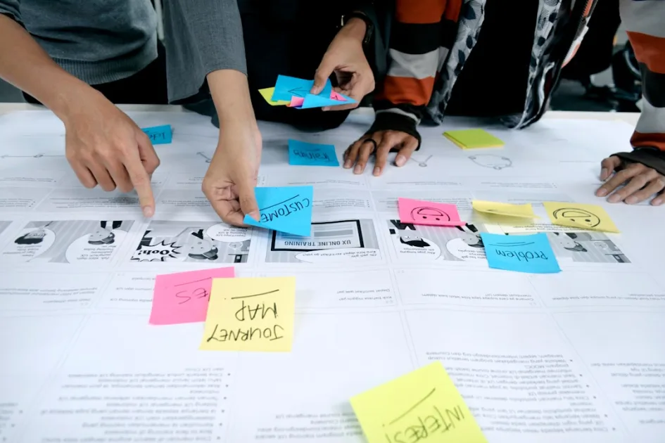 team collaborating with sticky notes