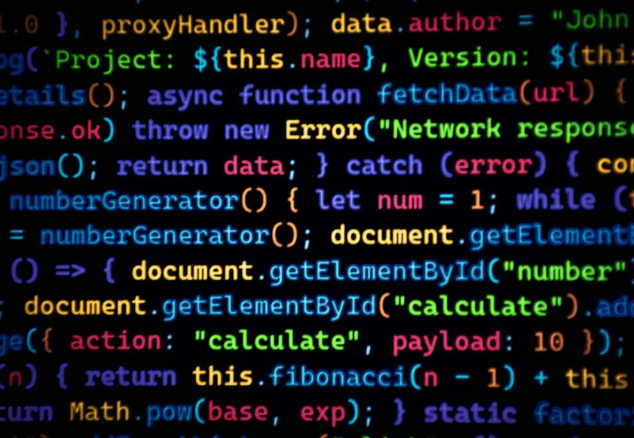 Colorful code scrolls across a dark background